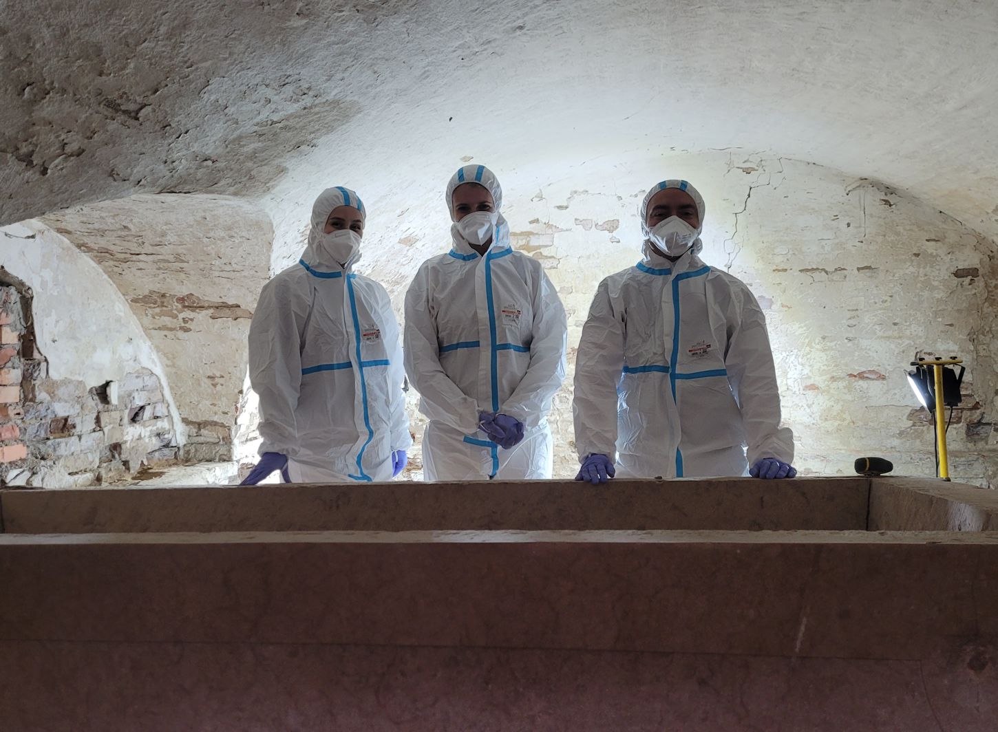 Staff of the History and Local Community Research Department during work in the crypt